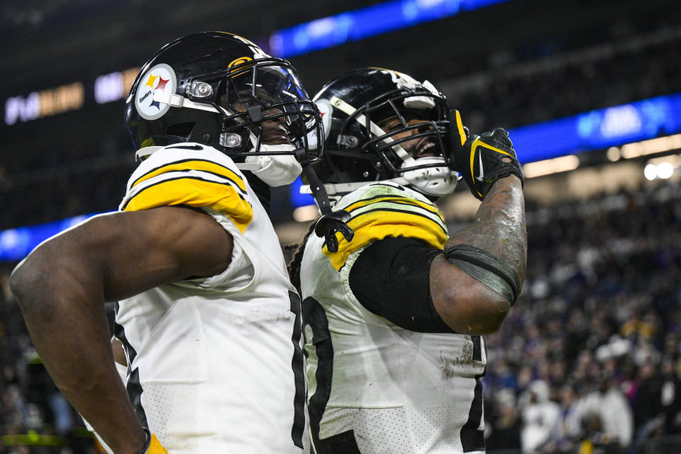 Pittsburgh Steelers running back Najee Harris, right, celebrates a touchdown with wide receiver George Pickens (14) in the second half of an NFL football game against the Baltimore Ravens in Baltimore, Fla., Sunday, Jan. 1, 2023. (AP Photo/Nick Wass)