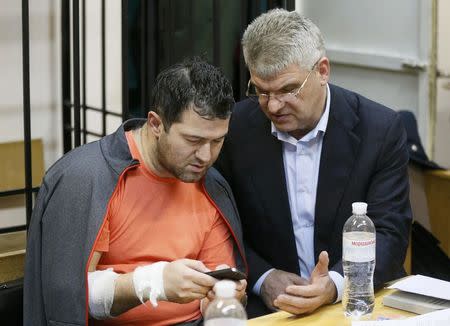 Head of Ukraine's tax and customs service Roman Nasirov (L), who is under investigation over the suspected embezzlement, and his attorney attend a court hearing in Kiev, Ukraine, March 6, 2017. REUTERS/Valentyn Ogirenko