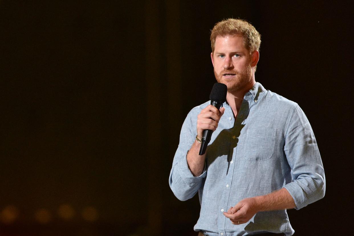 Co-Chair Britain's Prince Harry, Duke of Sussex, gestures as he speaks onstage during the taping of the 