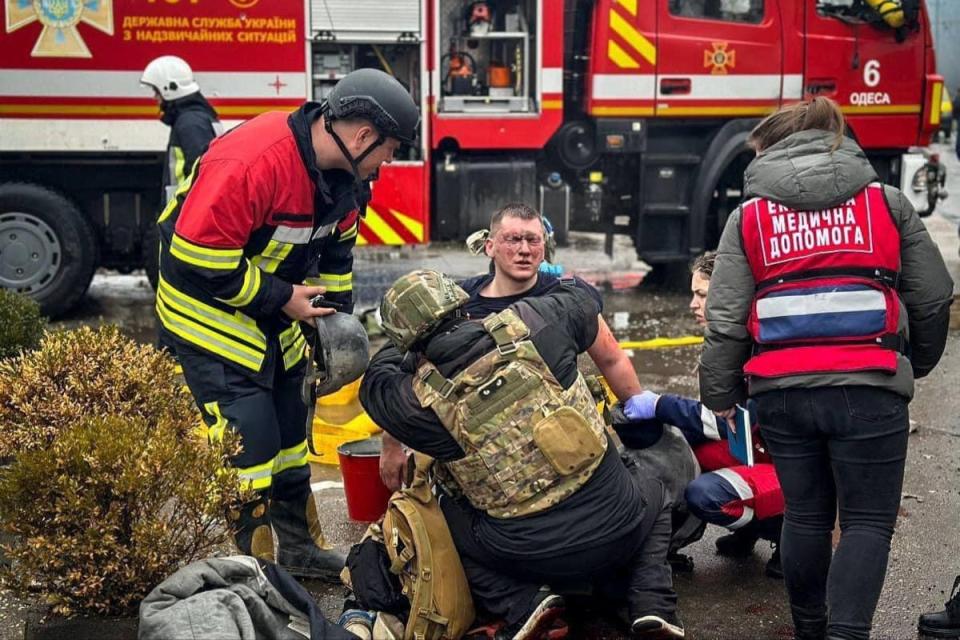Emergency service workers tend to an injured colleague (Telegram)