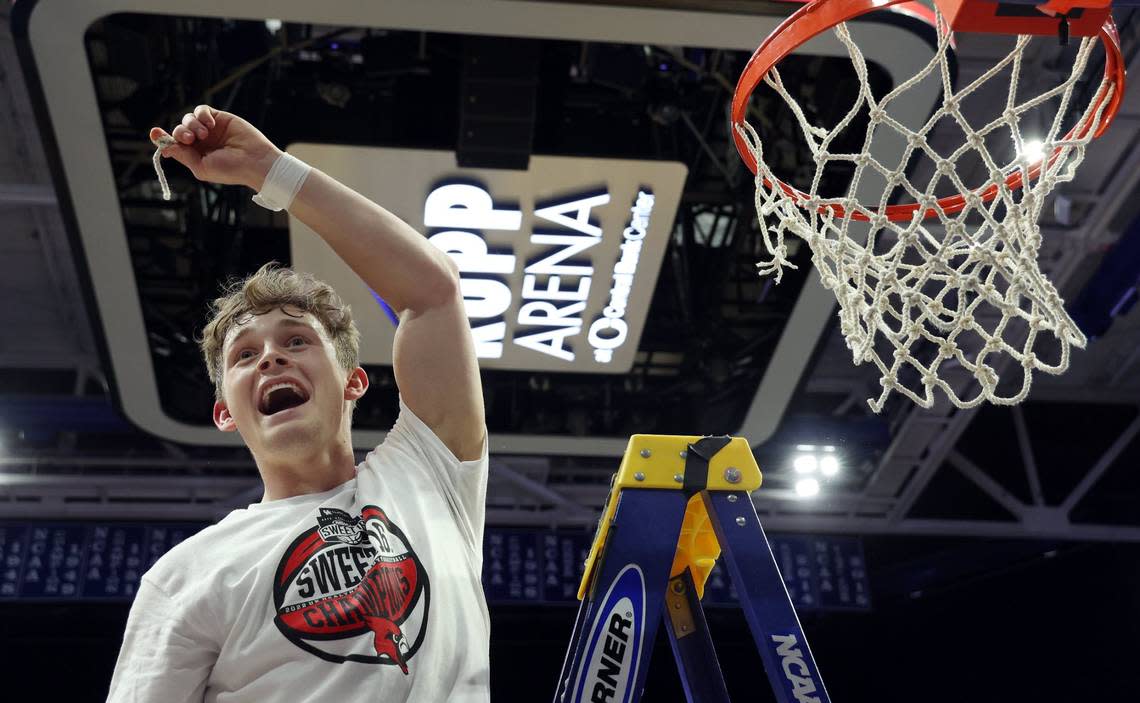 Aden Slone displays a piece of the net after George Rogers Clark won the Boys’ Sweet Sixteen in Rupp Arena last season. The Cardinals were to begin their title defense this week in the 40th District Tournament at Bourbon County. James Crisp