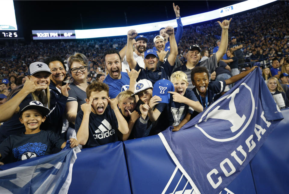BYU fans cheer in the second half of an NCAA college football game against South Florida Saturday, Sept. 25, 2021, in Provo, Utah. (AP Photo/George Frey)