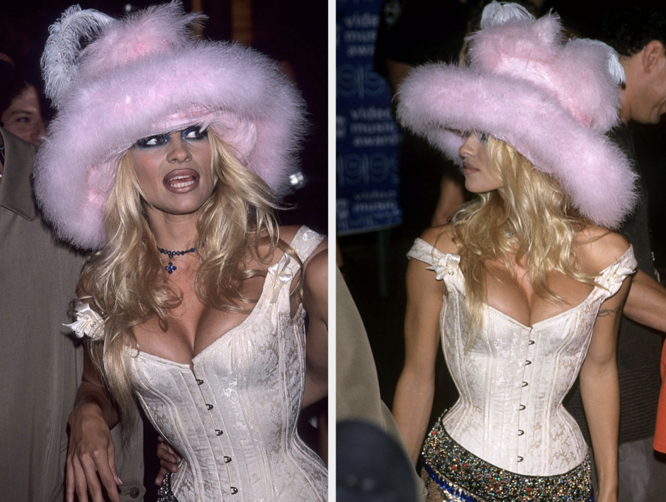 closeup of her wearing a corset and a large fluffy hat