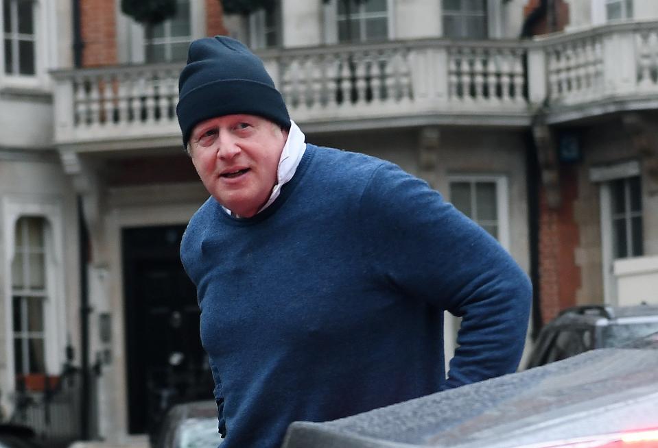 Johnson outside his house today (EPA)