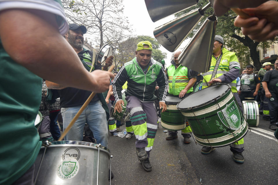 Anti-government protesters play instruments outside Congress as lawmakers debate a reform bill promoted by Argentine President Javier Milei in Buenos Aires, Argentina, Wednesday, June 12, 2024. (AP Photo/Gustavo Garello)