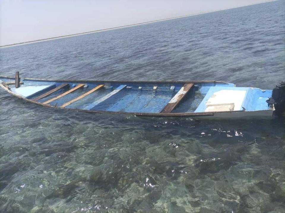 A capsized boat is seen near the coastal town of Obock, in northeastern Djibouti Tuesday, April 9, 2024. The United Nations migration agency says 38 migrants are dead and 22 others have been rescued from a shipwreck off Djibouti on a popular route to Yemen. (International Organization for Migration via AP)