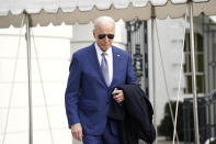 President Joe Biden walks to speak to the media before boarding Marine One on the South Lawn of the White House, Thursday, Jan. 18, 2024, in Washington. Biden is traveling to North Carolina to highlight $82 million in new investments that would connect 16,000 households and businesses to high-speed internet. (AP Photo/Yuri Gripas)