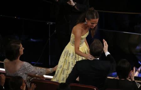 Alicia Vikander is congratulated for winning the Oscar for Best Supporting Actress for her role in "The Danish Girl" at the 88th Academy Awards in Hollywood, California February 28, 2016. REUTERS/Mario Anzuoni