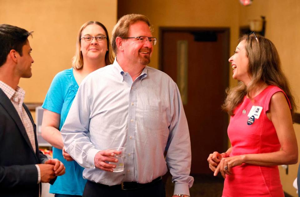 State Sen. Chuck Edwards laughs with supporter Bronwyn Lance, right, at the Mountain Lodge in Flat Rock, N.C. after Edwards defeated Rep. Madison Cawthorn in the NC-11 primary Tuesday, May 17, 2022.