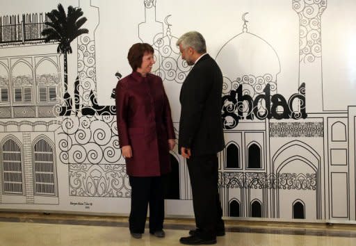 Iran's chief nuclear negotiator and head of Iran's national security council Saeed Jalili (R) chats European Union foreign policy chief, Catherine Ashton, before a meeting in Baghdad on May 23. Tehran has "no reason" to suspend its enrichment of uranium to 20 percent, one of the key demands of world powers engaging Iran in talks, the head of its Atomic Energy Organisation said late Saturday