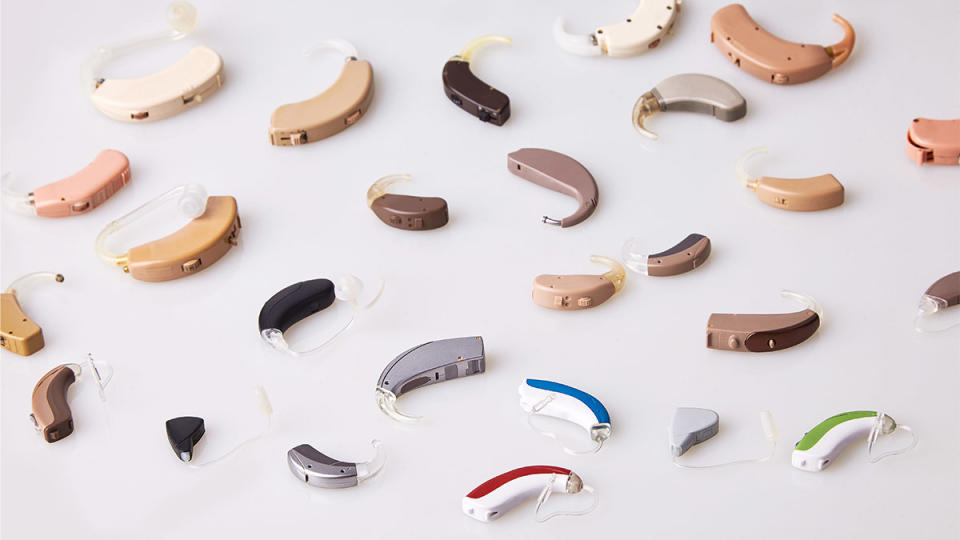 array of hearing aids, like you'd get at Walmart, on a table