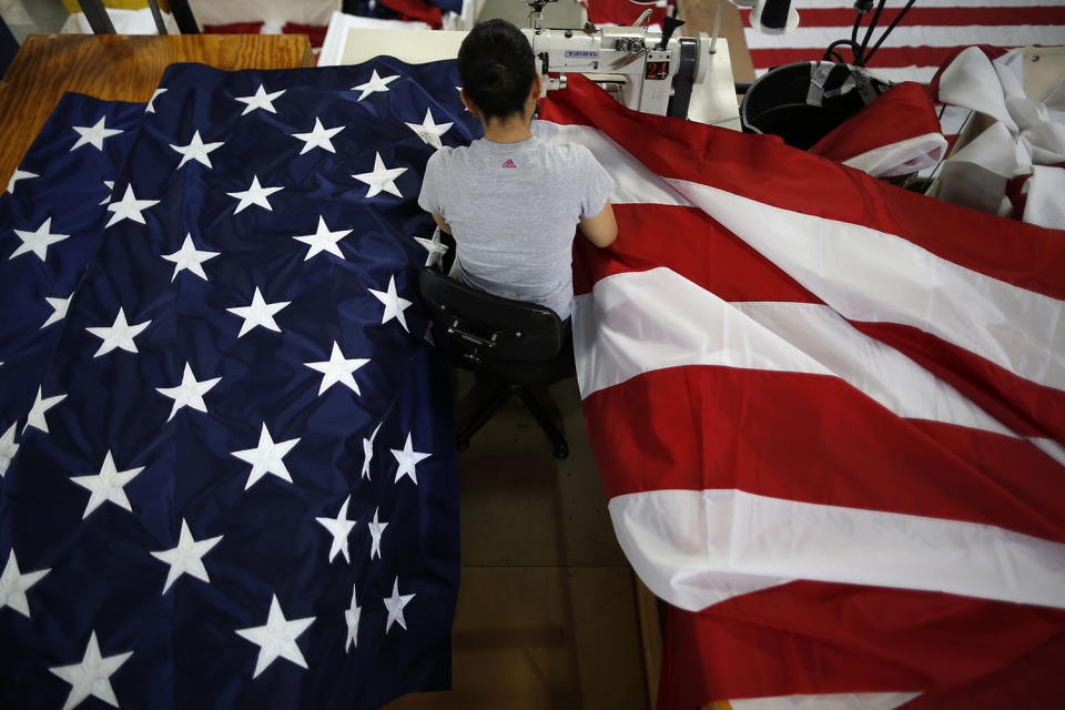 <p>A worker sews an American flag at the FlagSource facility in Batavia, Illinois, U.S., on Tuesday, June 27, 2017. (Photo: Jim Young/Bloomberg via Getty Images) </p>