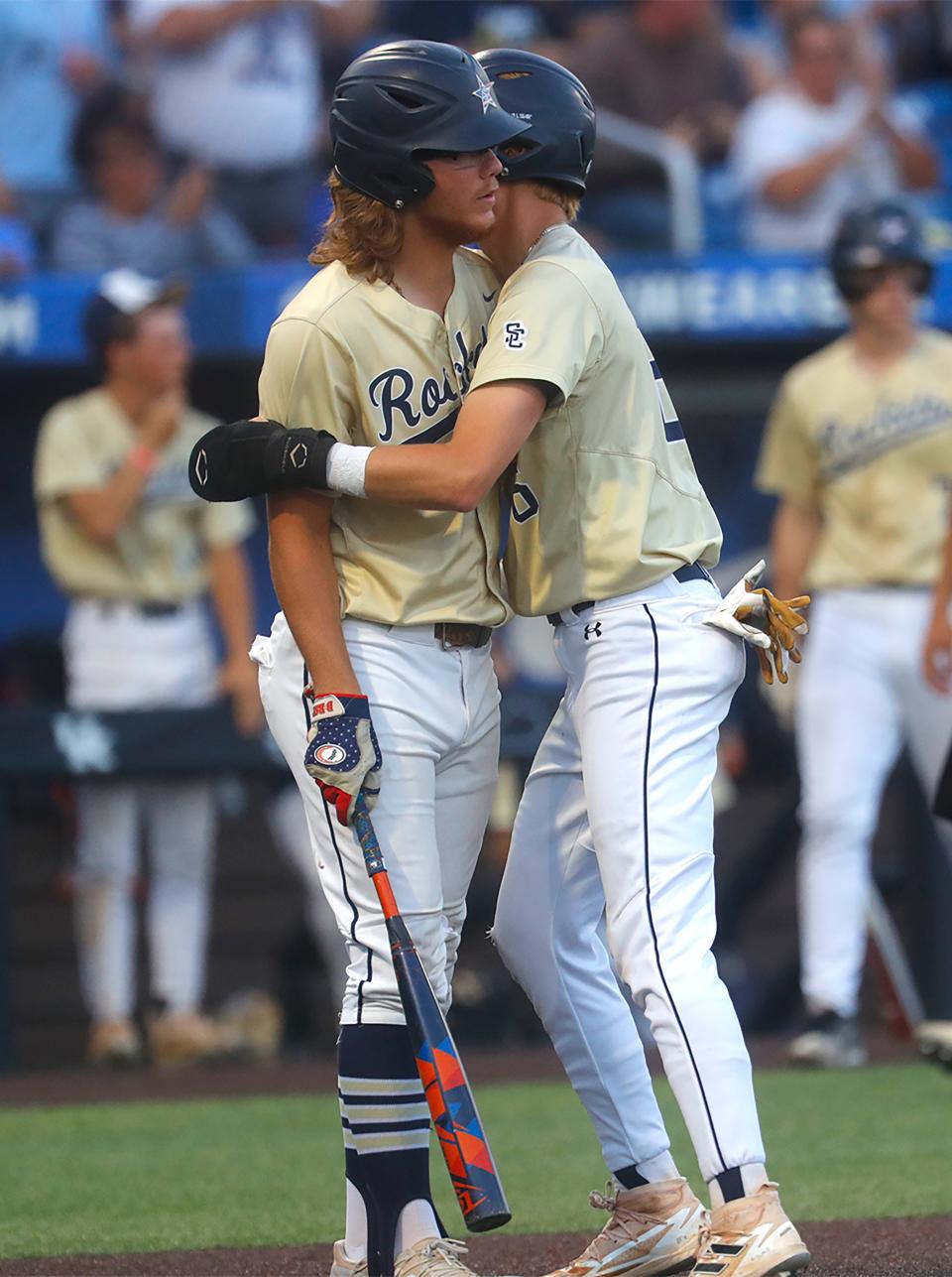 Shelby County’s Kemper Whisman scores and hugs teammate Hunter Cook against Whitley County in the KHSAA Baseball Championship game.Une 10, 2023