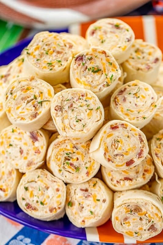 <p>Plain Chicken</p><p>Pinwheels are always one of the first things to fly off the appetizer table.</p><p><strong>Get the recipe: <a href="https://www.plainchicken.com/crack-chicken-pinwheels-football-friday/" rel="nofollow noopener" target="_blank" data-ylk="slk:Crack Chicken Pinwheels;elm:context_link;itc:0;sec:content-canvas" class="link rapid-noclick-resp">Crack Chicken Pinwheels</a></strong></p>
