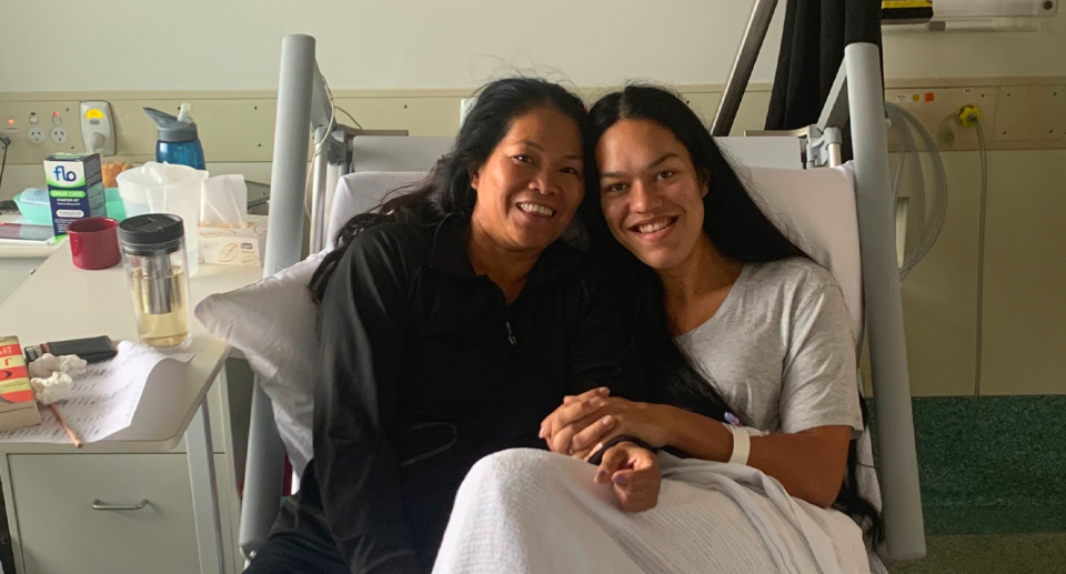 Shari with her mother, while she recovers in hospital from treatment. 