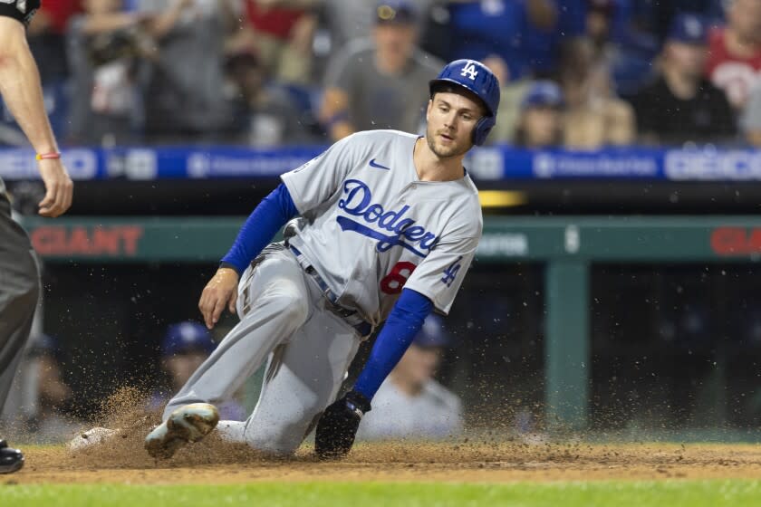 PHILADELPHIA, PA - AUGUST 10: Trea Turner #6 of the Los Angeles Dodgers slides home safely