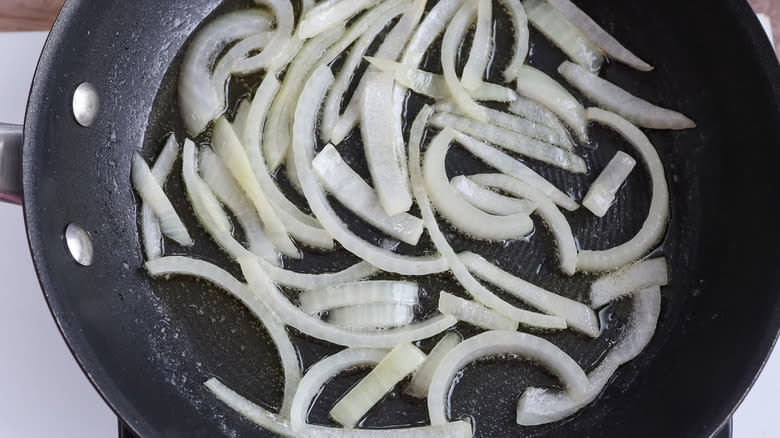 onions cooking in skillet