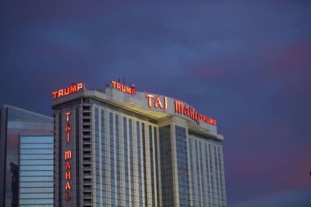 The Trump Taj Mahal Casino is illuminated at dusk in Atlantic City, New Jersey, in this October 24, 2014 file photo. REUTERS/Mark Makela/Files