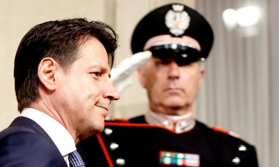 A salute for Giuseppe Conte, Italy’s prime minister to be, as he arrives at Rome’s Quirinal Palace