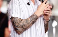 <p>The "Mom" tattoo on his arm was, “A last-ditch effort to gain my mother’s approval," the singer said. "She hates this one slightly less than the others.”</p>