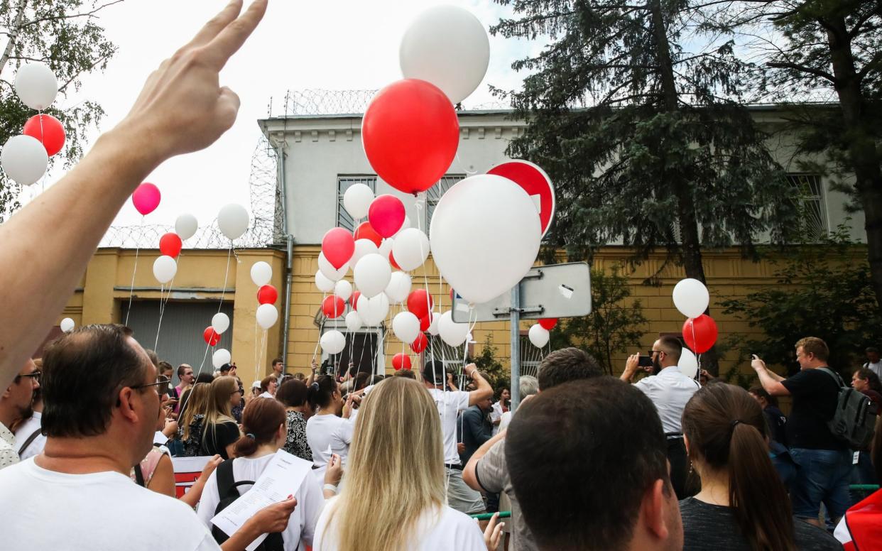 Opposition activists take part in a rally - TASS