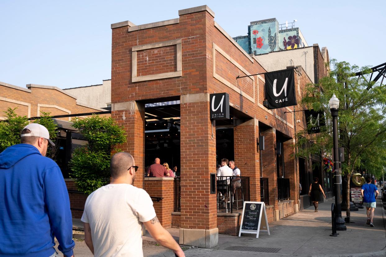 Pedestrians walk past Union Cafe Thursday on North High Street and Hull Alley in Columbus' Short North district.