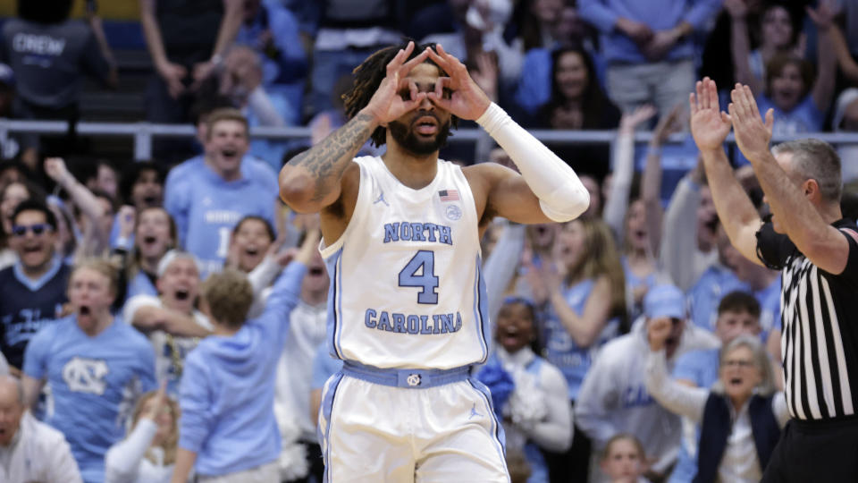 North Carolina guard RJ Davis (4) celebrates after shooting a 3-point basket against Miami during the second half of an NCAA college basketball game Monday, Feb. 26, 2024, in Chapel Hill, N.C. (AP Photo/Chris Seward)
