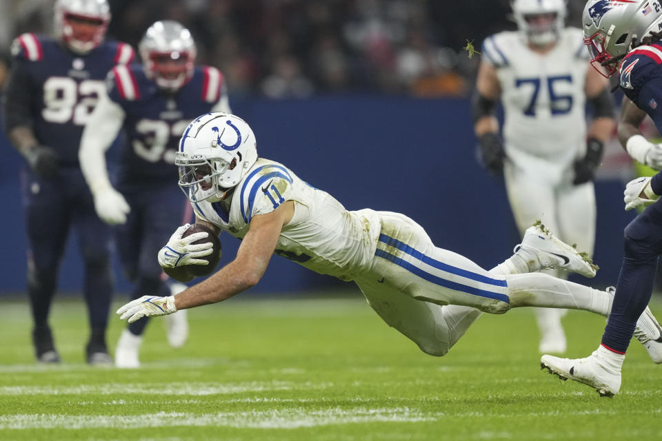 Indianapolis Colts wide receiver Michael Pittman Jr. (11) carries on a reception in the second half of an NFL football game against the New England Patriots in Frankfurt, Germany Sunday, Nov. 12, 2023. (AP Photo/Michael Probst)