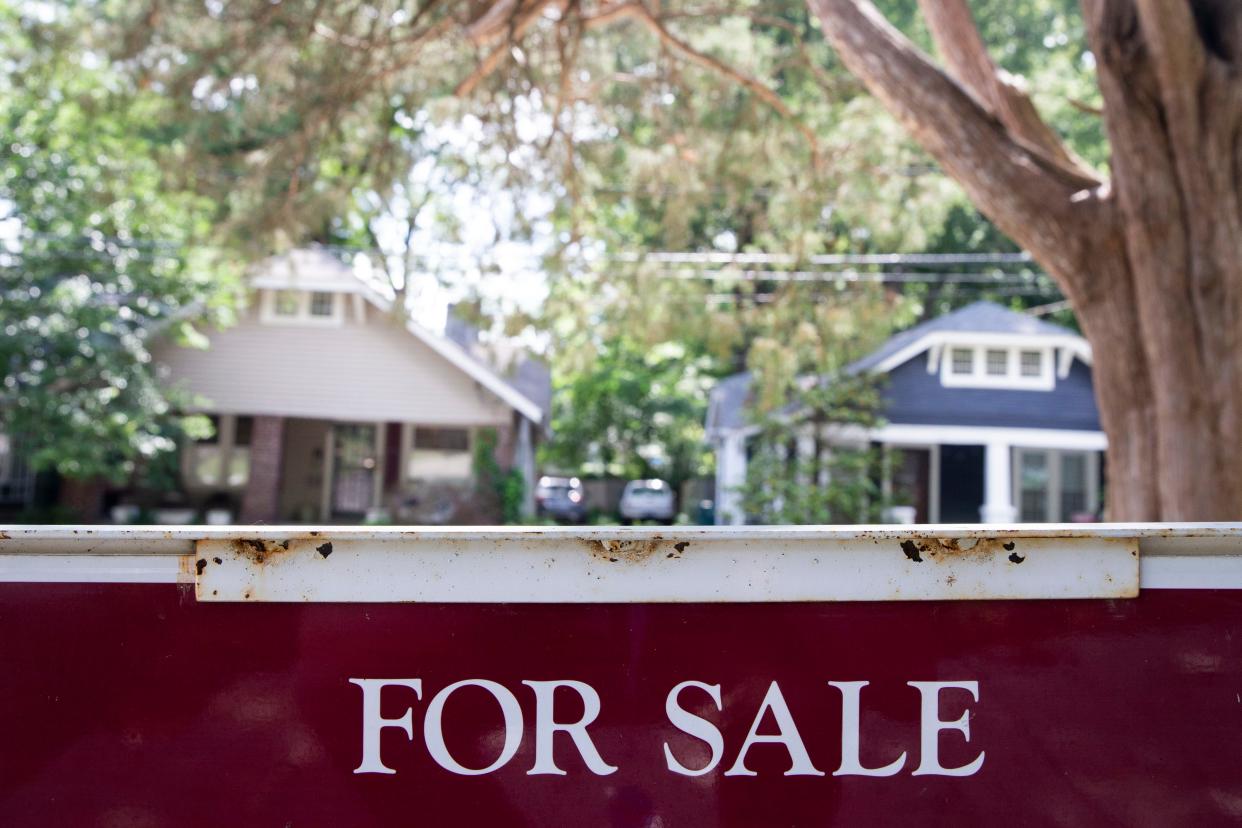 A “for sale” sign is seen in front of a home in Midtown Memphis, on Thursday, June 22, 2023.