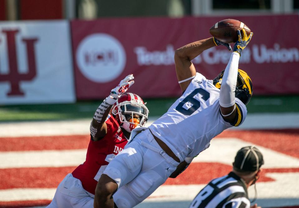 Michigan Wolverines wide receiver Cornelius Johnson (6) catches a touchdown pass against Indiana Hoosiers defensive back Jaylin Williams (23) during the first quarter of the game against the Michigan Wolverines at Memorial Stadium on Nov 7, 2020 in Bloomington, Indiana.