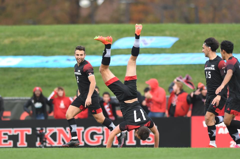 Rutgers' Ola Maeland does a cartwheel after scoring the go-ahead goal in the Big Ten Tournament final