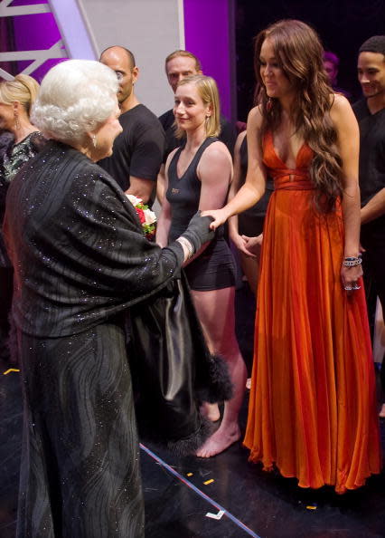 <p>Miley put on a somewhat chesty display in this bright orange dress. However, it being full length we think it was probably the last time she wore so much fabric. <i>[Photo: LEON NEAL/AFP/Getty Images]</i></p>