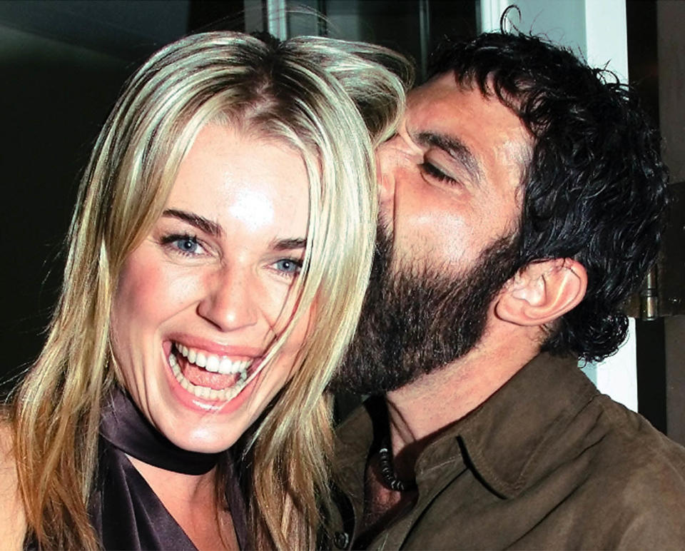 American actress Rebecca Romijn-Stamos and Spanish star Antonio Banderas pose for photos following a press conference for their film "Femme Fatale," which is to premiere at the 27th Toronto International Film Festival in Toronto, September 14, 2002. "Femme Fatale" was directed by Brian De Palma REUTERS/Mike Cassese MC