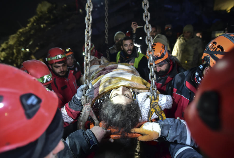 Rescue teams use a crane to rescue Nur Bayraktar in Kahramanmaras, southern Turkey, late Friday, Feb. 10, 2023. Friday, Feb. 10, 2023. Emergency crews made a series of dramatic rescues in Turkey on Friday, pulling several people, some almost unscathed, from the rubble, four days after a catastrophic earthquake killed more than 20,000.(Ismail Coskun/IHA via AP)
