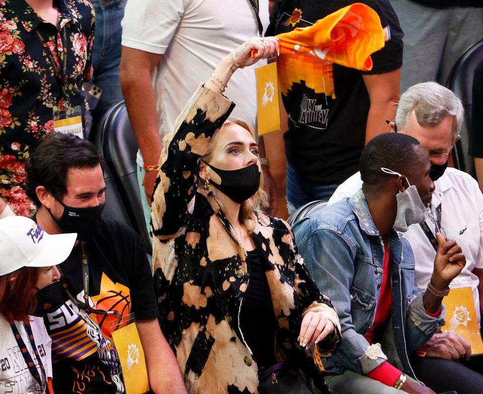 Adele waves a rally towel during the second half in Game Five of the NBA Finals between the Milwaukee Bucks and the Phoenix Suns at Footprint Center on July 17, 2021 in Phoenix, Arizona.