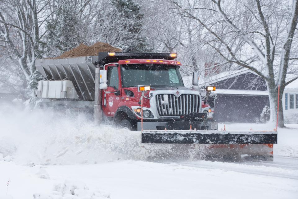 Snow plows with Shawnee County work to clear N.E. 62nd St. Tuesday morning. The area received about 3 inches of snow overnight.