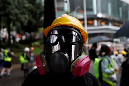 A masked protester attends an anti-government rally in central Hong Kong