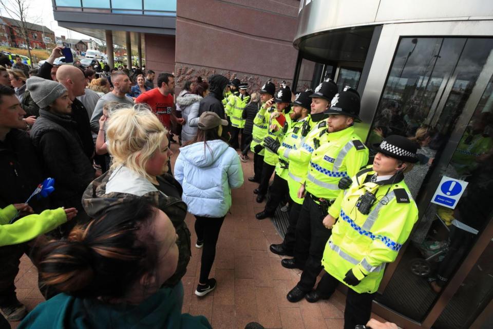 Police outside the children's hospital where Alfie is (PA)