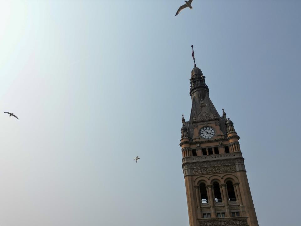 Birst fly above Milwaukee City Hall, Wednesday, June 14, 2023, in Milwaukee. A plan to prevent Milwaukee from going bankrupt struck between Republican lawmakers and leaders in the heavily Democratic city and Gov. Tony Evers, was up for approval Wednesday in the Wisconsin Legislature. (AP Photo/Morry Gash)