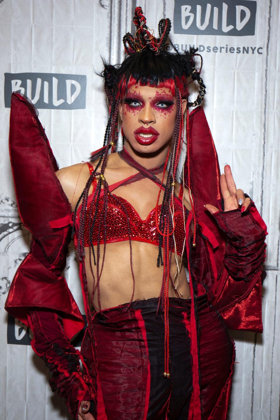 Yvie Oddly in red makeup and matching red outfit