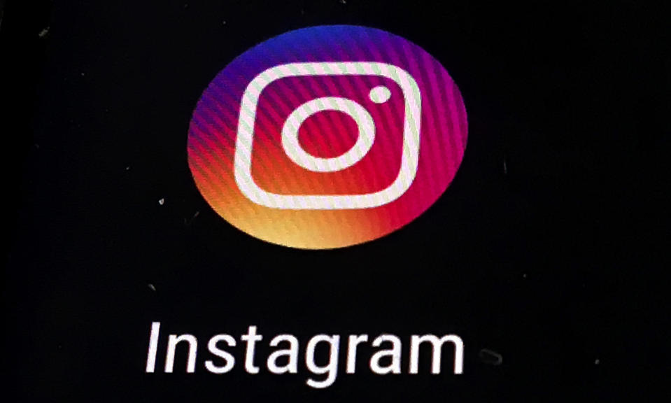 FILE - In this Nov. 29, 2018 file photo, the Instagram app logo is displayed on a mobile screen in Los Angeles. Though Black Out Tuesday was originally organized by the music community, the social media world went dark on Tuesday in support of the Black Lives Matter movement and the many killings of black people around the world that has caused outrage and protests. Instagram accounts, from top record label to everyday people, was full of black squares posted in response to the deaths of George Floyd, Ahmaud Arbery and Breonna Taylor. (AP Photo/Damian Dovarganes, File)