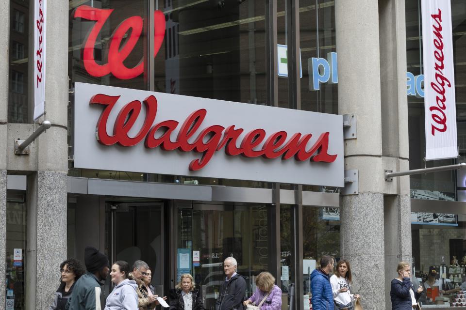 FILE - The entrance to a Walgreens is seen on Oct. 14, 2022, in Boston. Walgreens dove deeper into the health care sector on Monday, Nov. 7, when its VillageMD unit announced it would acquire another primary and urgent care provider, Summit Health-CityMD, in a deal worth close to $9 billion. (AP Photo/Michael Dwyer, File)