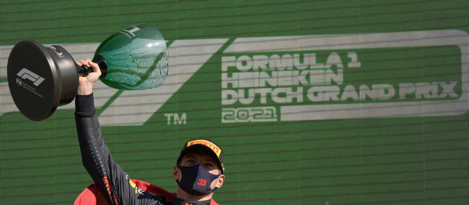 Red Bull driver Max Verstappen of the Netherlands celebrates on the podium after winning the Formula One Dutch Grand Prix, at the Zandvoort racetrack, Netherlands, Sunday, Sept. 5, 2021. (AP Photo/Francisco Seco)