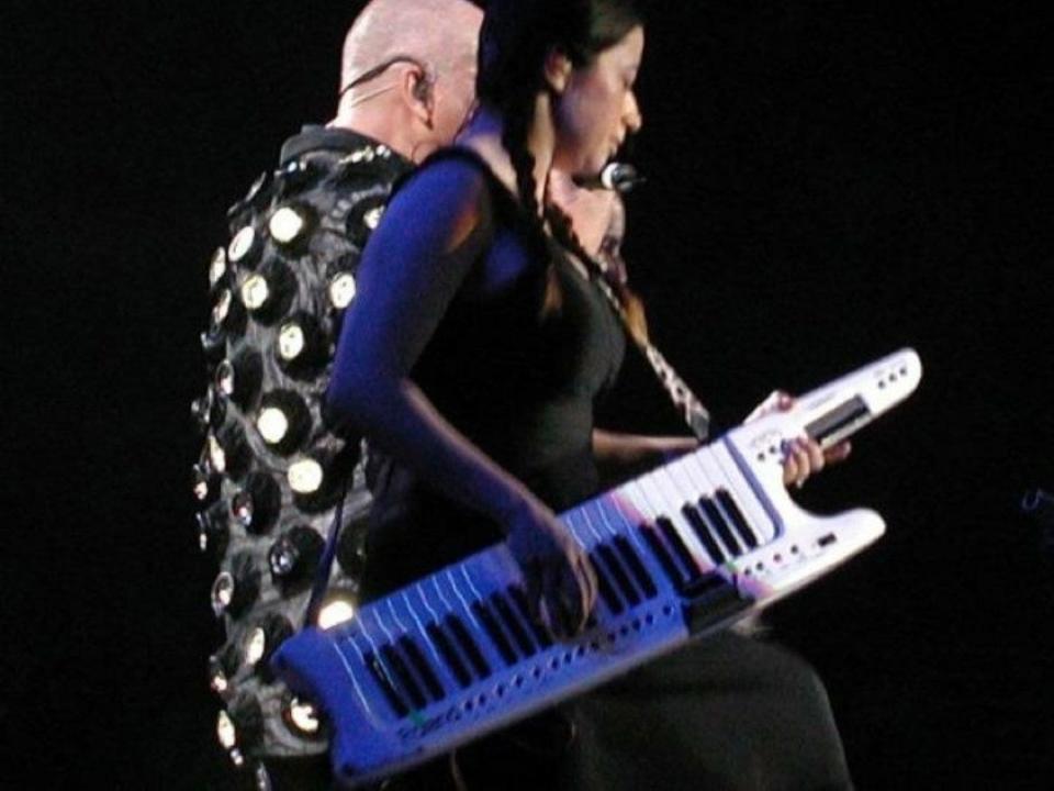 Rachel Z performs onstage with Peter Gabriel.