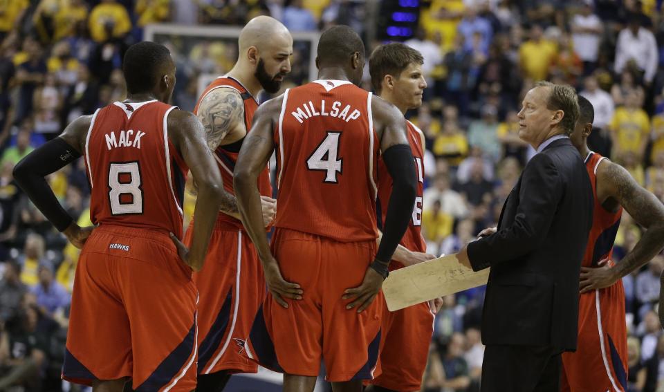 Atlanta Hawks head coach Mike Budenholzer talks to his team during the second half in Game 5 of an opening-round NBA basketball playoff series against the Indiana Pacers Monday, April 28, 2014, in Indianapolis. Atlanta defeated Indiana 107-97. (AP Photo/Darron Cummings)