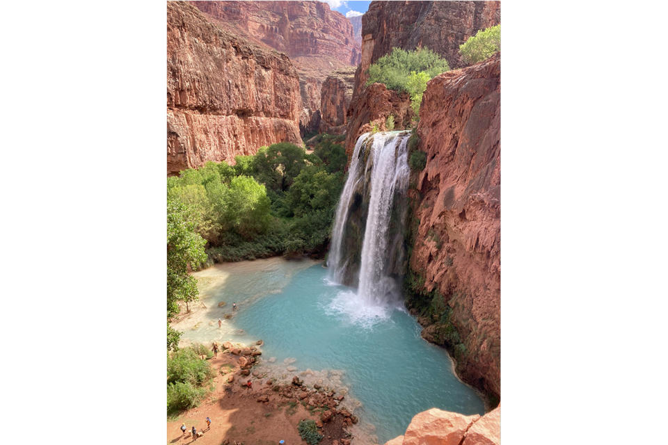 This photo provided by Francesca Dupuy shows the Havasu Falls on the Havasupai reservation in Arizona, Sept. 4, 2023. Dozens of tourists say they fell ill on a recent visit to a popular and picturesque stretch of waterfalls deep in a gorge neighboring Grand Canyon National Park. (Francesca Dupuy via AP)