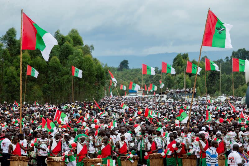 FILE PHOTO: Supporters of Burundi's ruling party, the National Council for the Defense of Democracy-Forces for the Defense of Democracy (CNDD-FDD), attend a campaign rally of their presidential candidate Evariste Ndayishimiye at the Bugendana Stadium