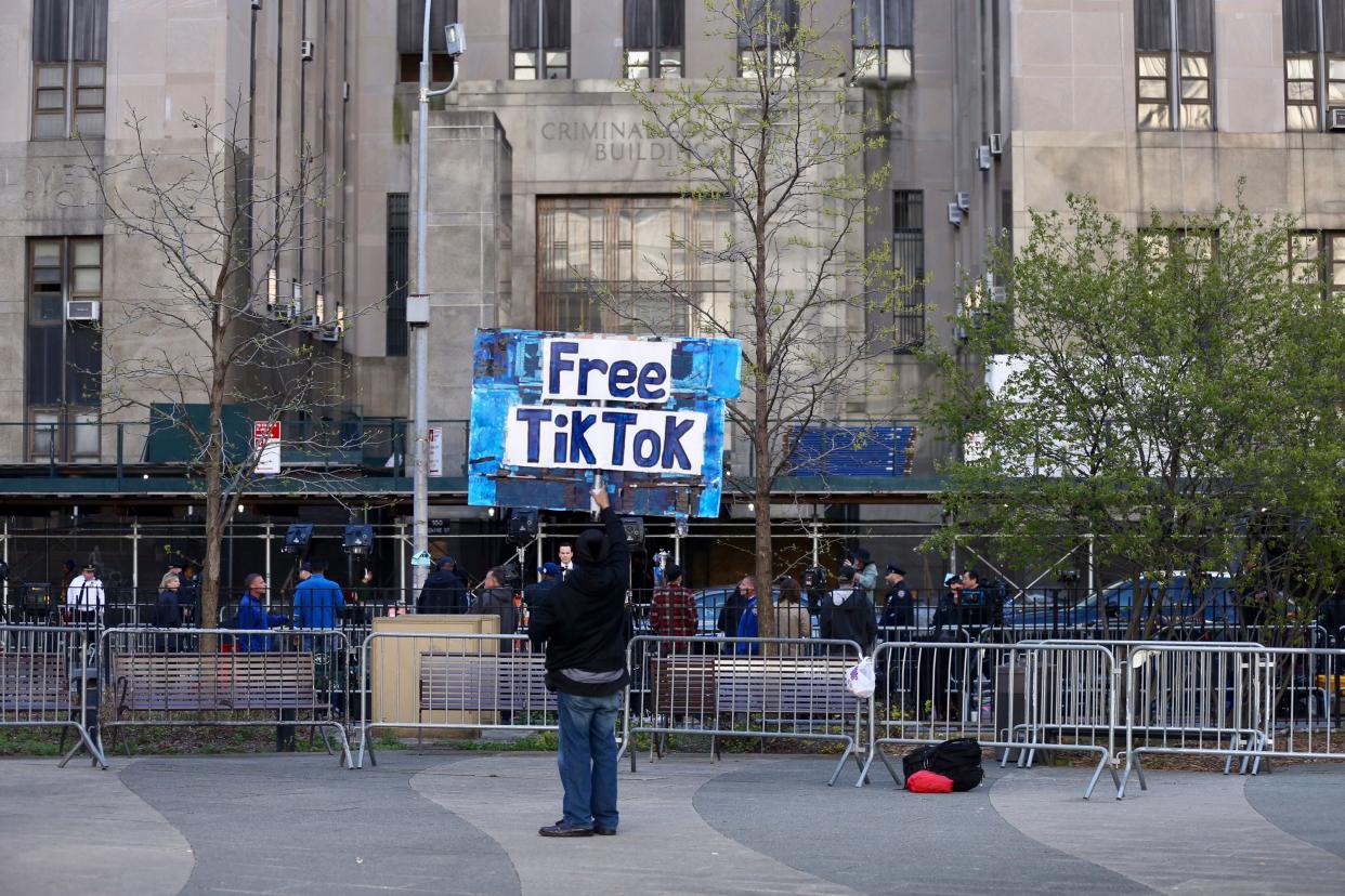 Members of the media and a few protestors gather outside of the New York State Supreme Court for the arrival of former President Donald Trump on April 16, 2024 in New York City.