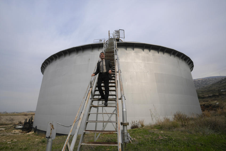 Lebanese Energy Minister Walid Fayad tours the Biddawi oil facility in the northern city of Tripoli, Lebanon, Tuesday, Dec. 28, 2021. Fayad launched two projects in the country’s north on Tuesday to facilitate the flow of natural gas from Egypt. The move aims to improve electricity production and expand the country’s tanks to increase oil reserves. (AP Photo/Hassan Ammar)