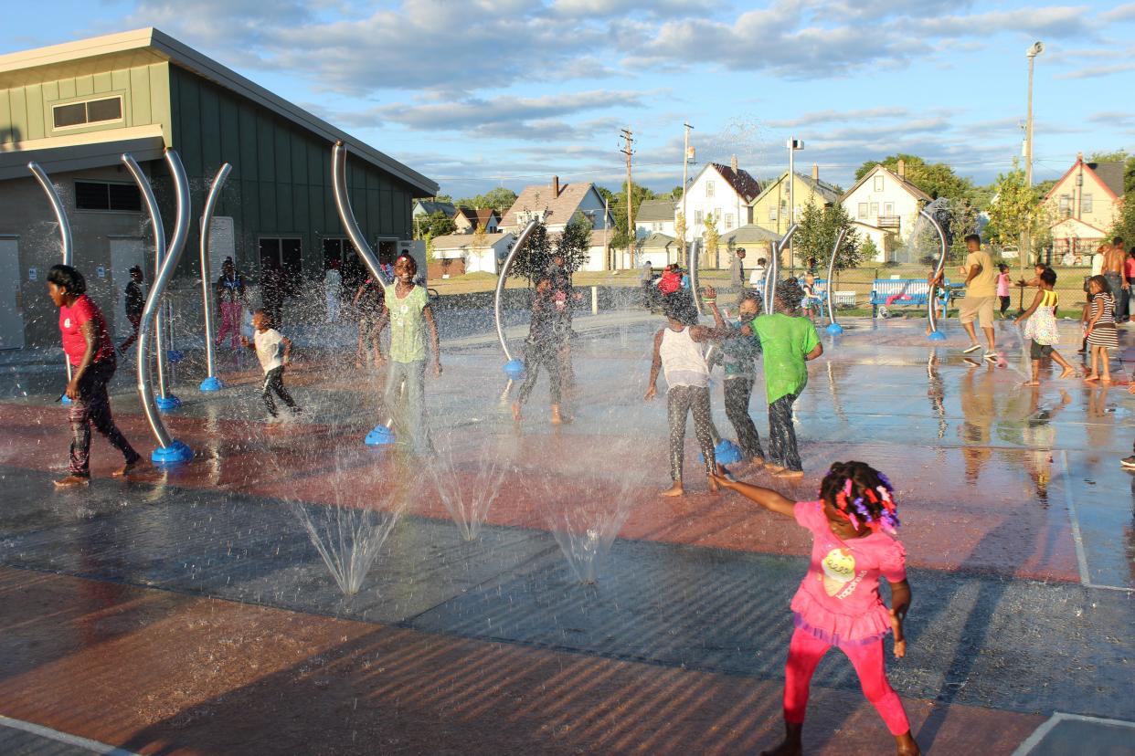 Kids play in the splash pad of Moody park in the Amani neighborhood.
